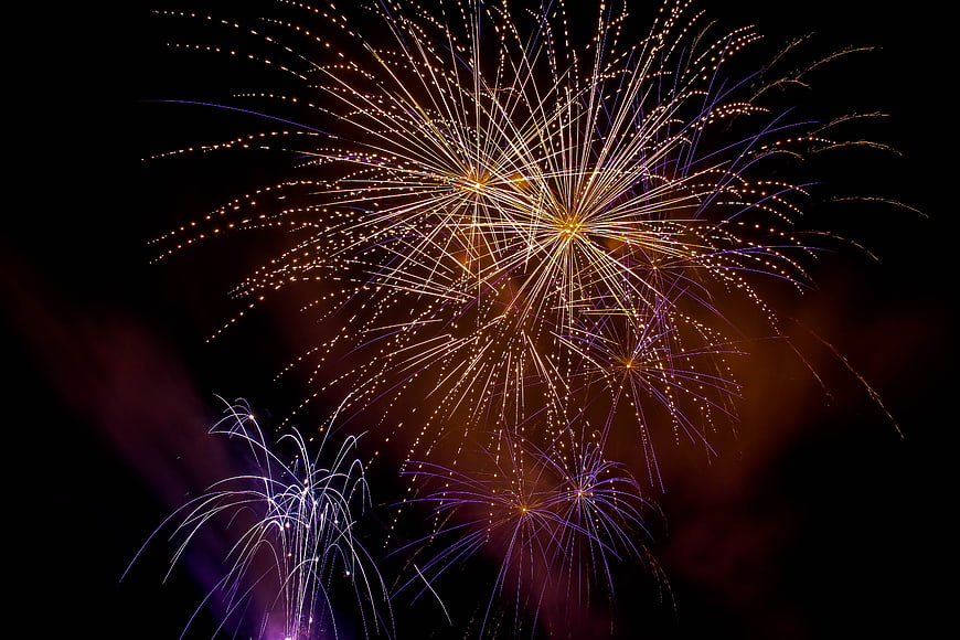 Colorful fireworks exploding in the night sky
