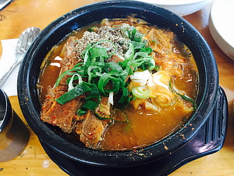 Korean Bone Soup Stew With Green Onions And Sesame Seeds