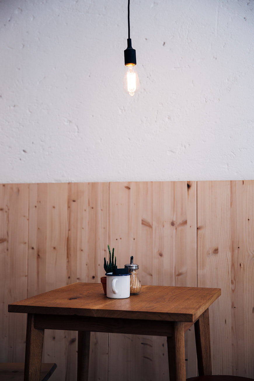 Minimalist Wooden Cafe Table with Pendant Light