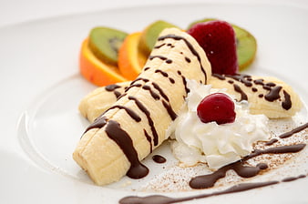 Banana Split Dessert with Whipped Cream and Chocolate Sauce