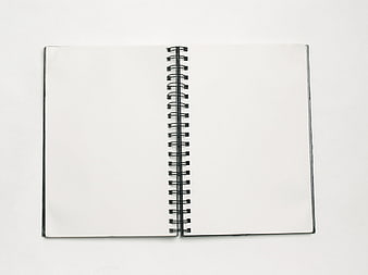Blank spiral notebook open on white background