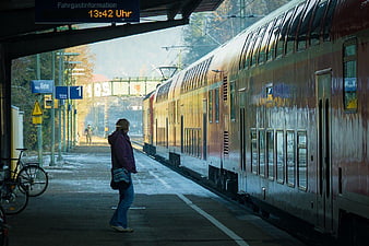 Woman Waiting for Train at Station Platform