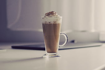 Iced Coffee with Whipped Cream on Desk