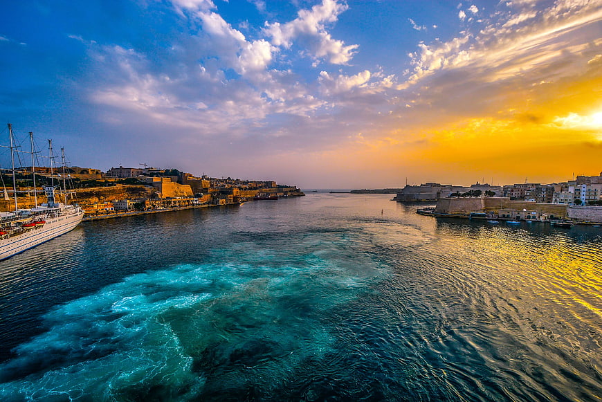 Grand Harbour Malta Sunset with Sailboat Wake