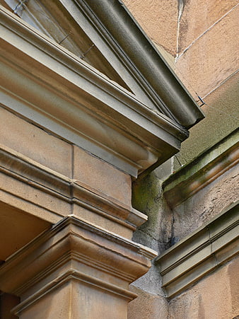 Close-up of weathered stone architectural details and molding