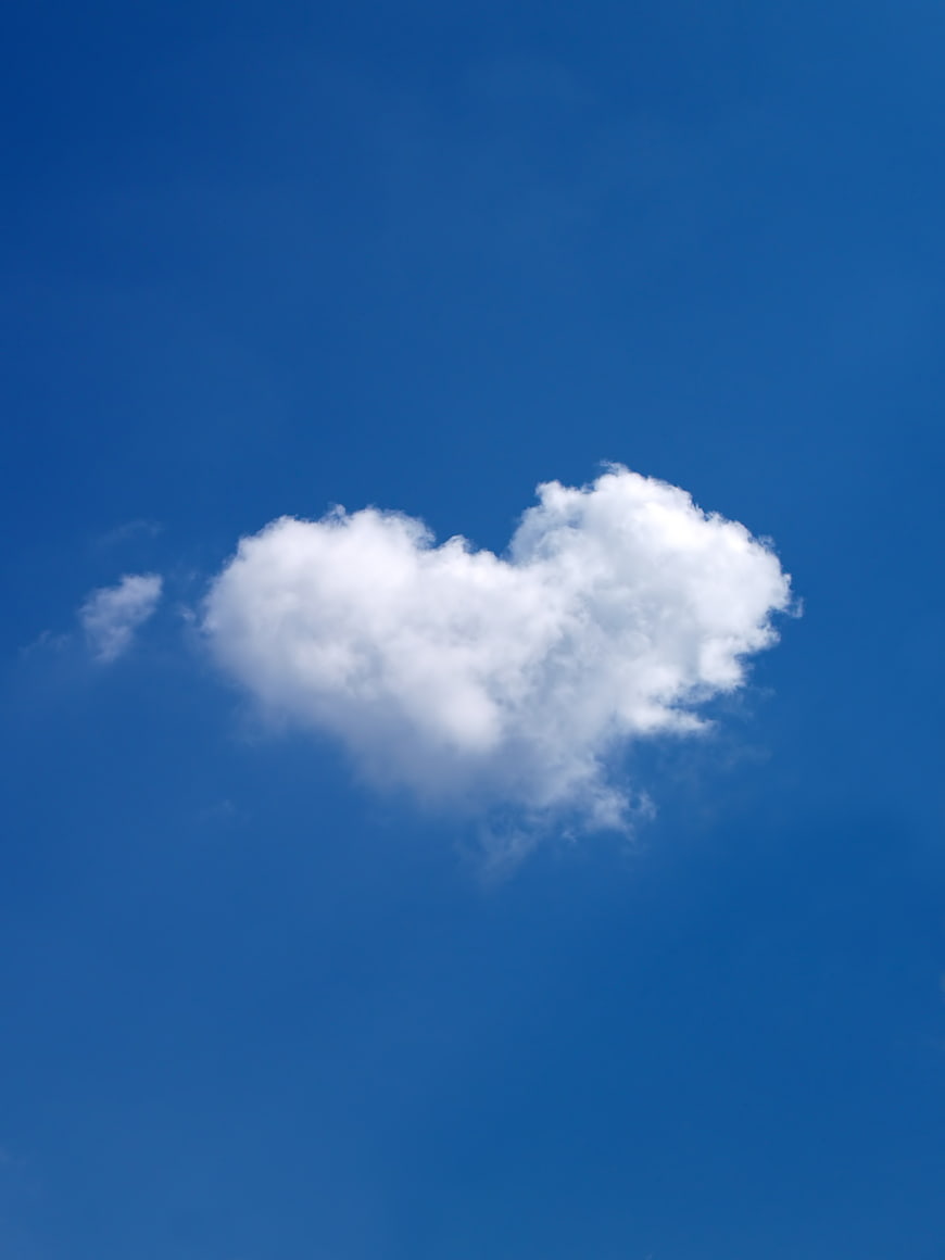 Heart Shaped White Cloud in Blue Sky