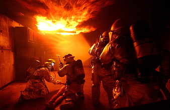 Firefighters Training Exercise In Intense Fire Room
