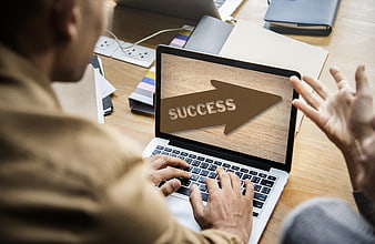 Businessman Typing On Laptop With Success Arrow Graphic