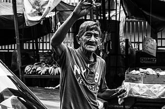 Elderly Man Selling Razors in Venezuelan Street Market