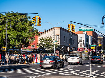 Busy Brooklyn Street Scene with Outdoor Market and Traffic