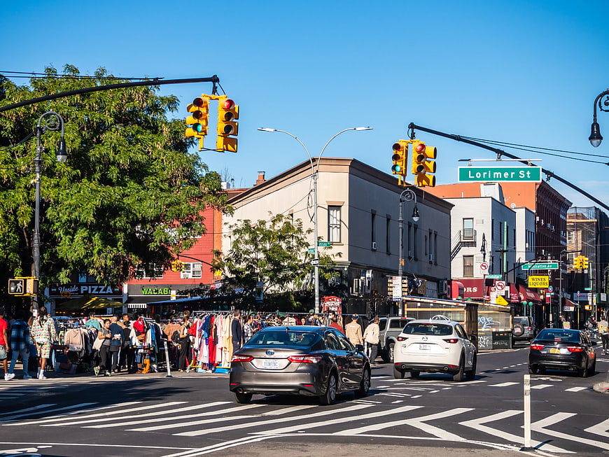 Busy Brooklyn Street Scene with Outdoor Market and Traffic