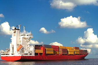 Red Cargo Ship with Containers on Blue Ocean