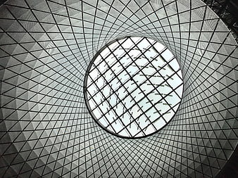 Abstract geometric view of modern glass dome ceiling