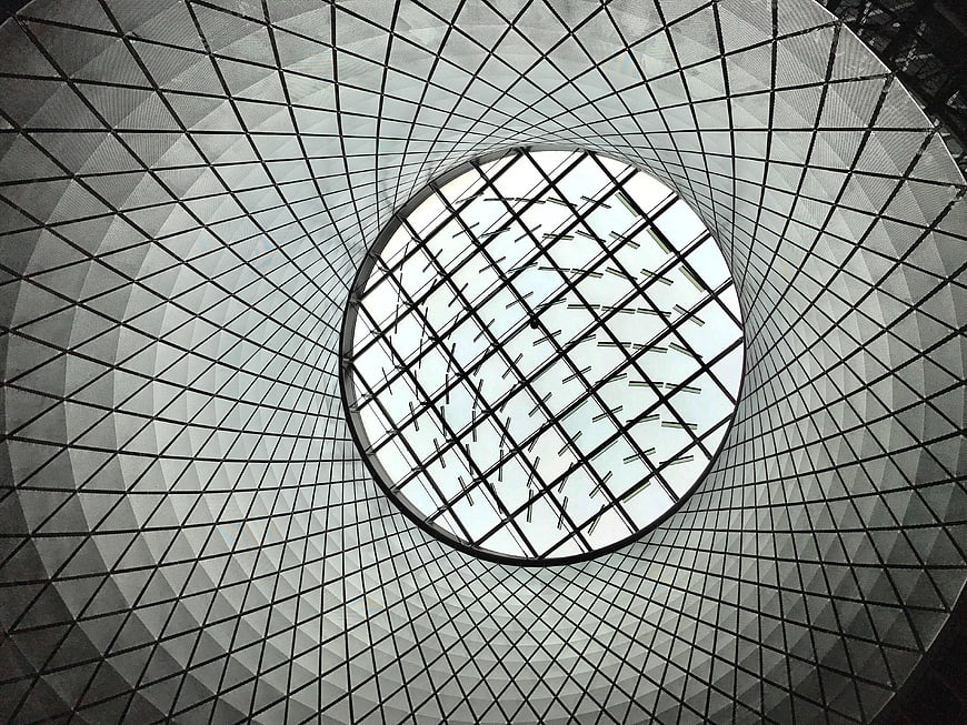 Abstract geometric view of modern glass dome ceiling
