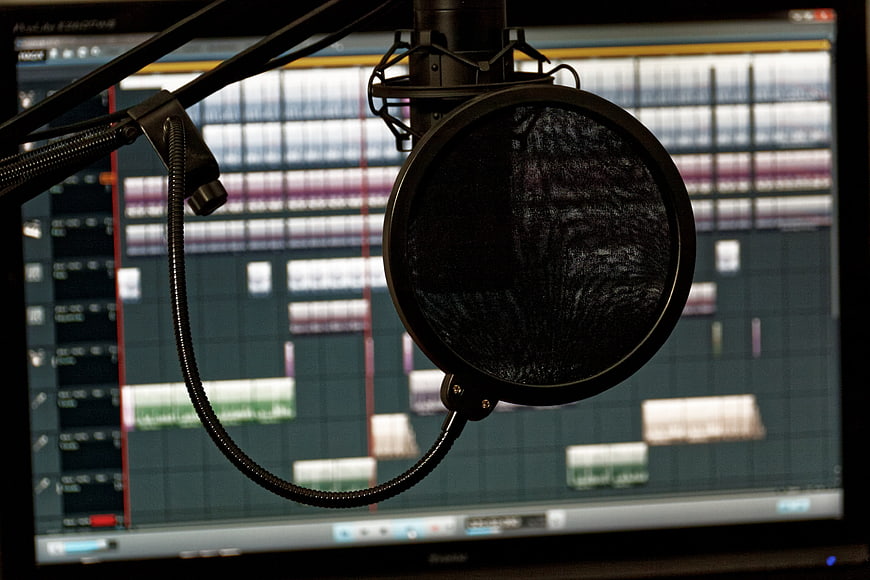 Professional Microphone with Pop Filter in Recording Studio