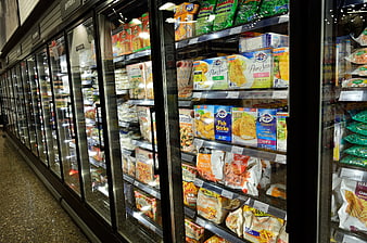 Frozen food aisle in a modern supermarket with glass display cases