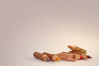 Short used colored pencils on white background