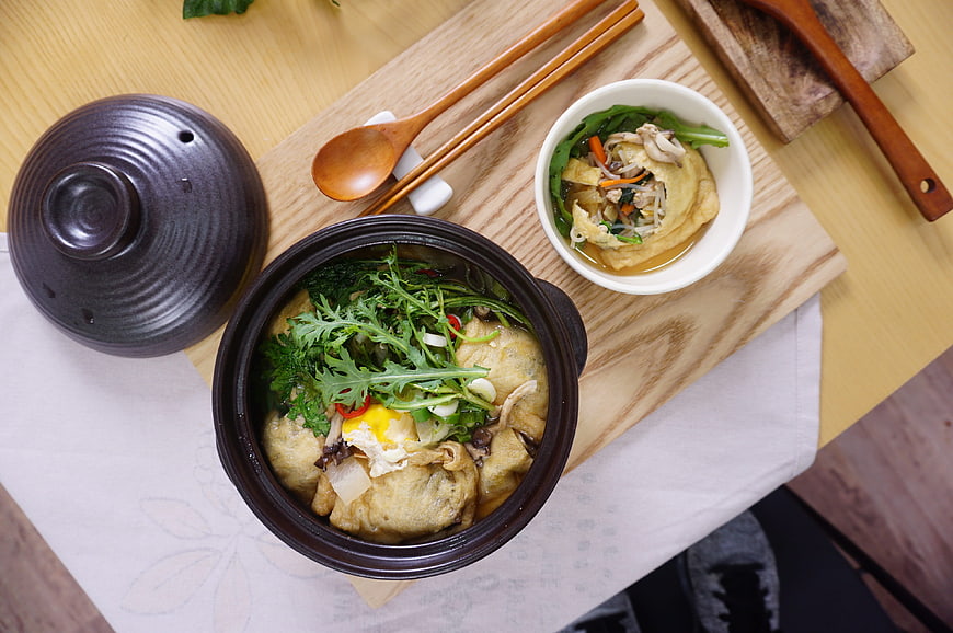 Korean Fish Cake Soup with Greens and Wooden Utensils