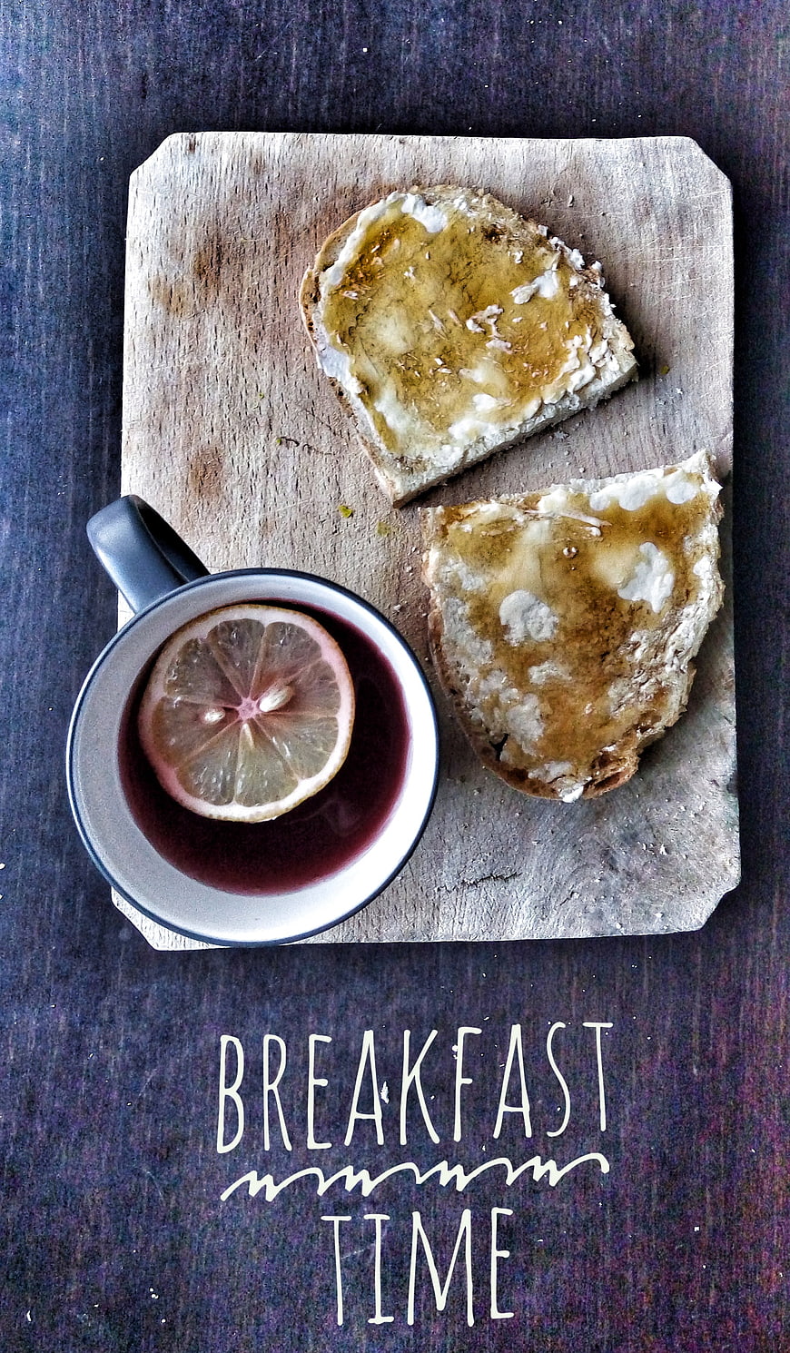 Rustic breakfast flat lay with honey bread and lemon tea