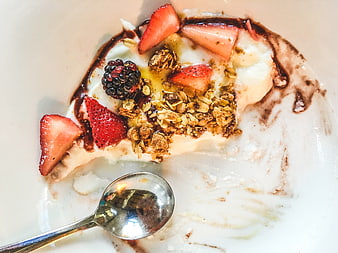 Overhead view of yogurt bowl with granola and berries