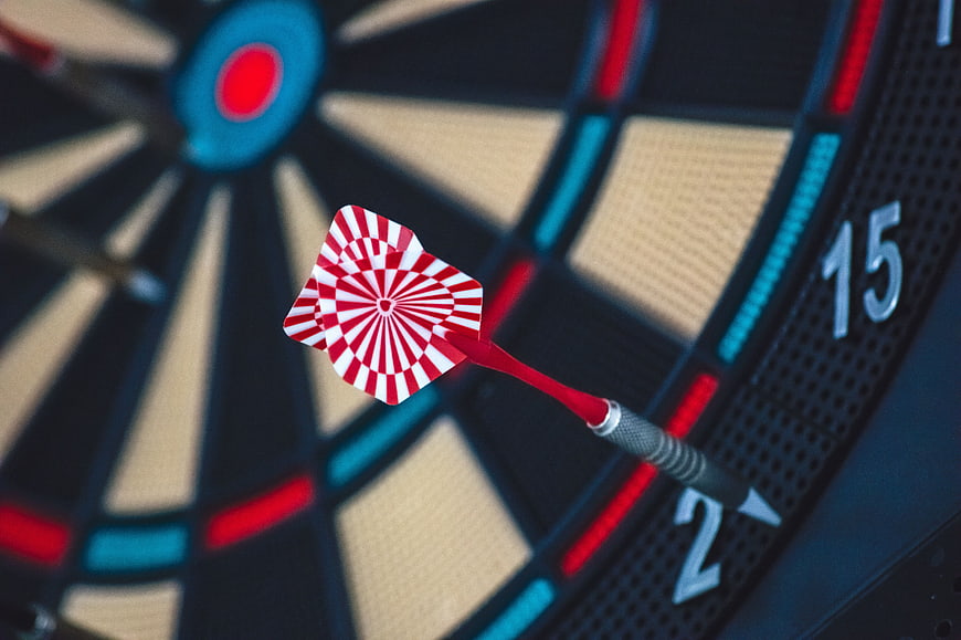 Red and White Dart Hitting Target on Board