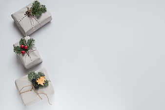 Minimalist Christmas Gifts Wrapped in Kraft Paper with Pine Branches