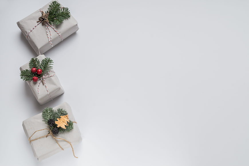 Minimalist Christmas Gifts Wrapped in Kraft Paper with Pine Branches