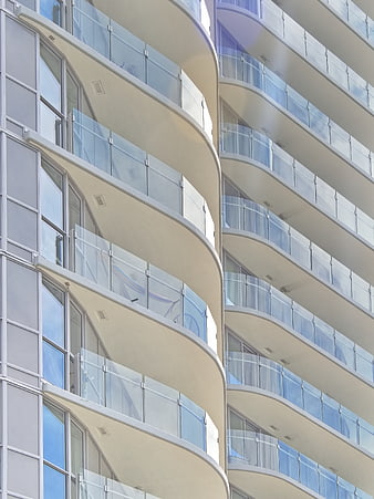 Modern Curved Apartment Building Facade with Glass Balconies