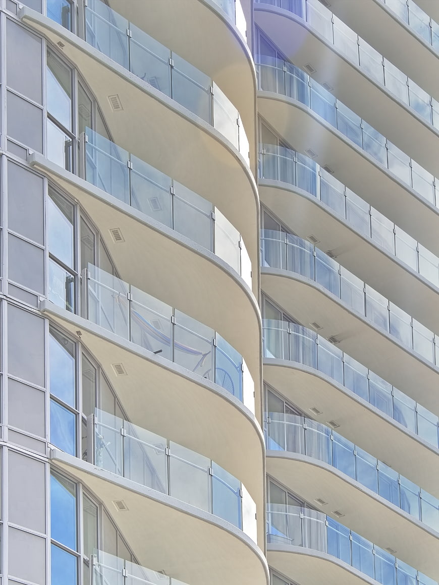 Modern Curved Apartment Building Facade with Glass Balconies