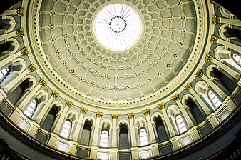 Grand architectural dome ceiling with intricate coffered design and skylight