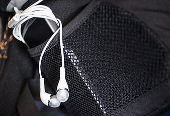White Earphones in Black Mesh Bag Pocket