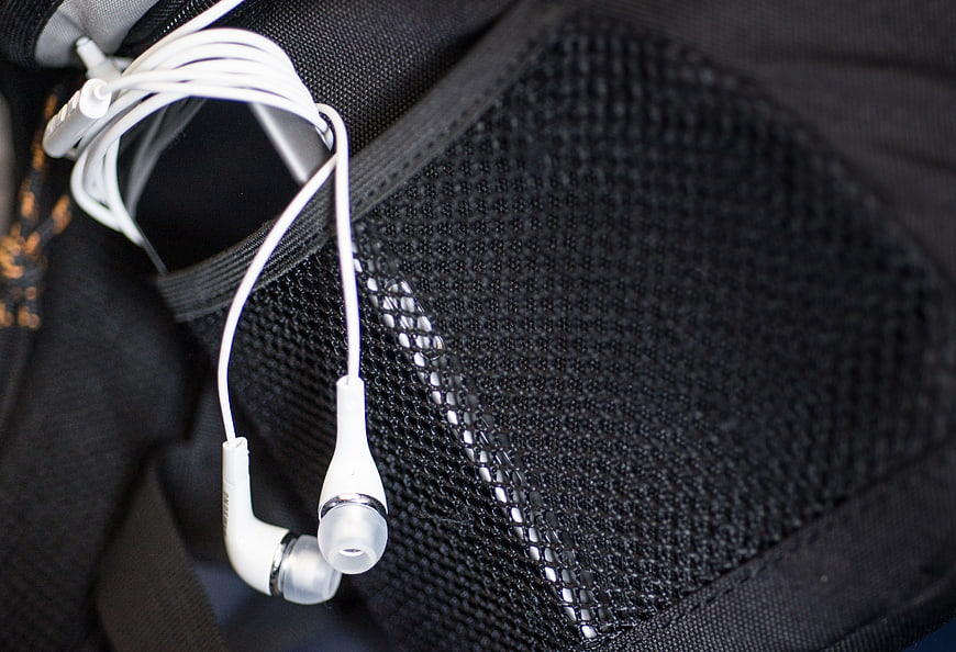 White Earphones in Black Mesh Bag Pocket