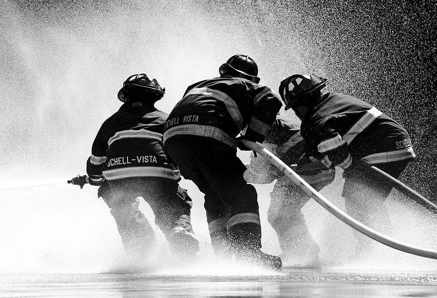 Firefighters battling blaze with high-pressure hose