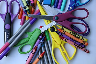 Colorful school supplies and art materials on white background