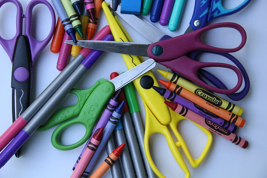 Colorful school supplies and art materials on white background