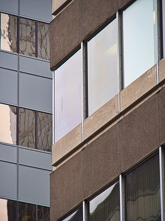 Modern Office Building Facade with Glass Windows and Concrete