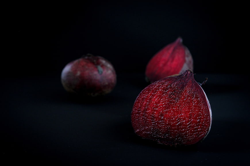 Fresh Red Beetroots on Black Background