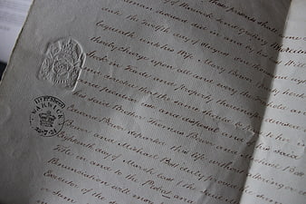 Close-up of vintage legal document with wax seal and stamp