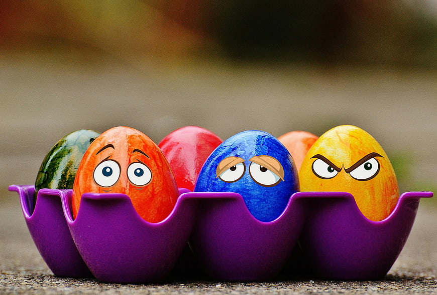 Colorful Easter Eggs with Funny Faces in Purple Holder