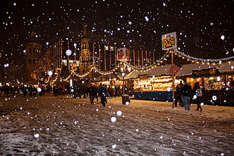 Snowy Night at a Traditional European Christmas Market