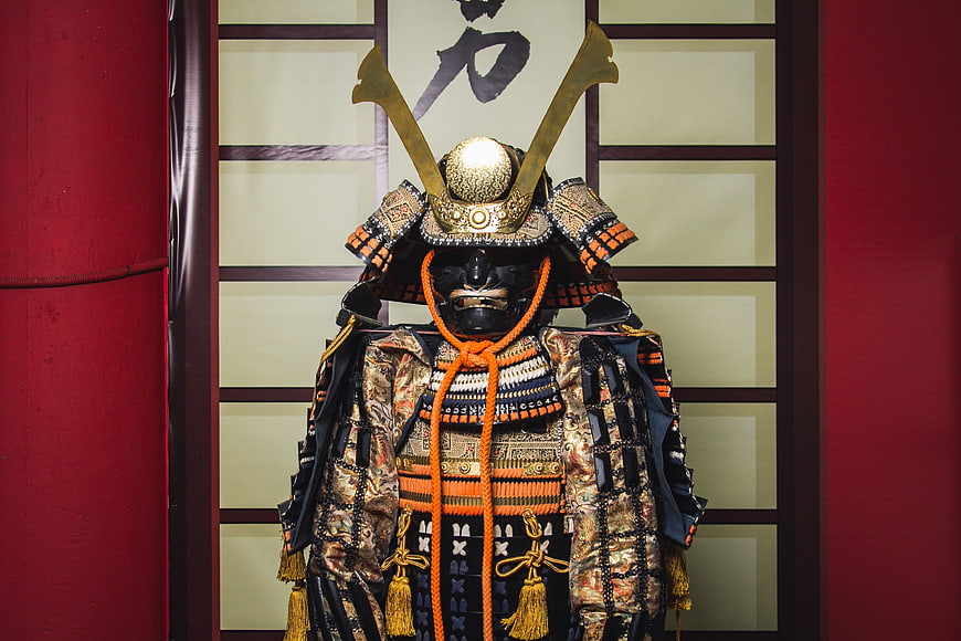 Traditional Japanese Samurai Armor With Golden Helmet And Mask