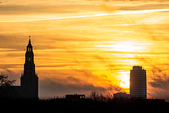 Silhouette of Martini Tower and Kempkensberg at Orange Sunrise