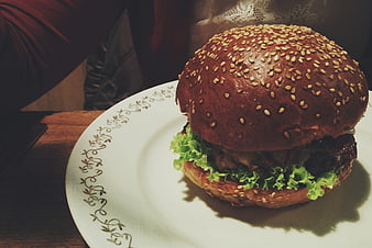 Delicious sesame seed burger on a white plate