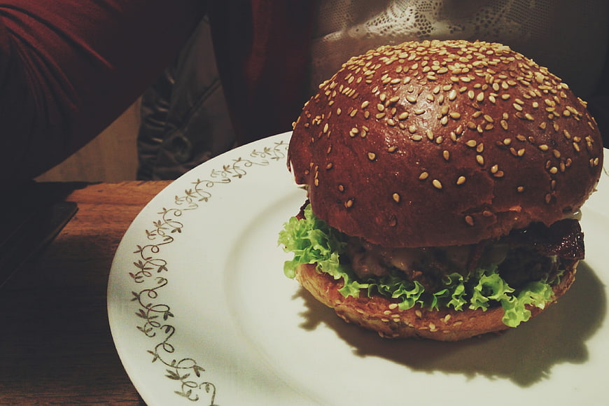 Delicious sesame seed burger on a white plate