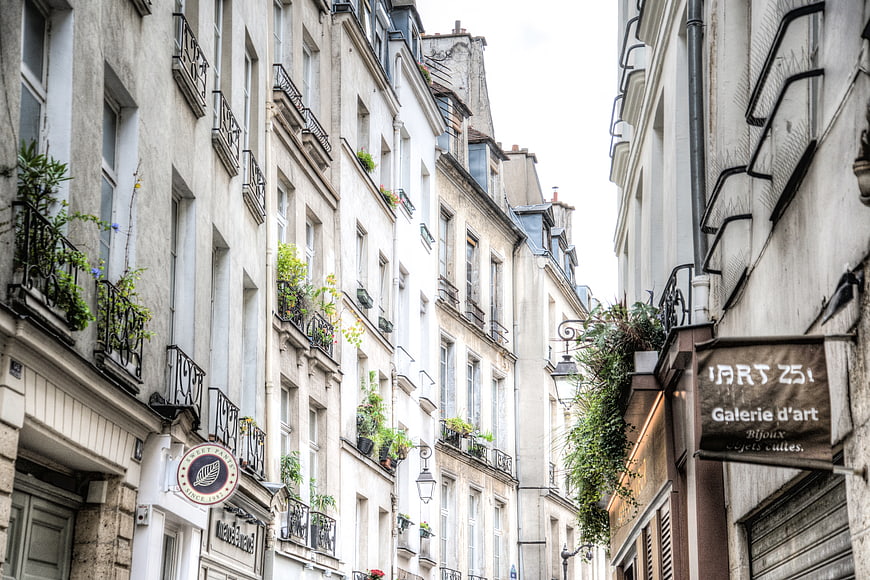 Narrow Parisian Street with Haussmann Architecture and Balconies