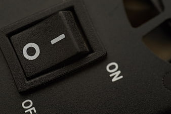 Close-up of black rocker power switch in off position