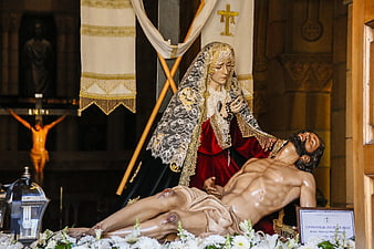 Catholic religious sculpture of Jesus and Mary in a church setting