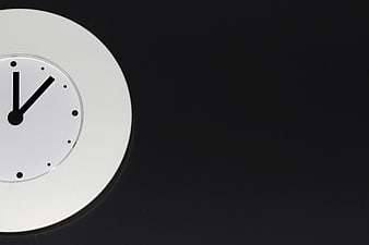 Minimalist White Clock on Black Background with Copyspace