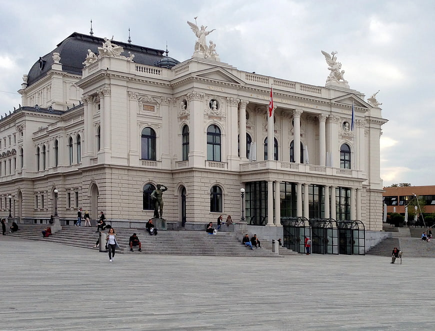 Grand White Neoclassical Building with Statues and Plaza