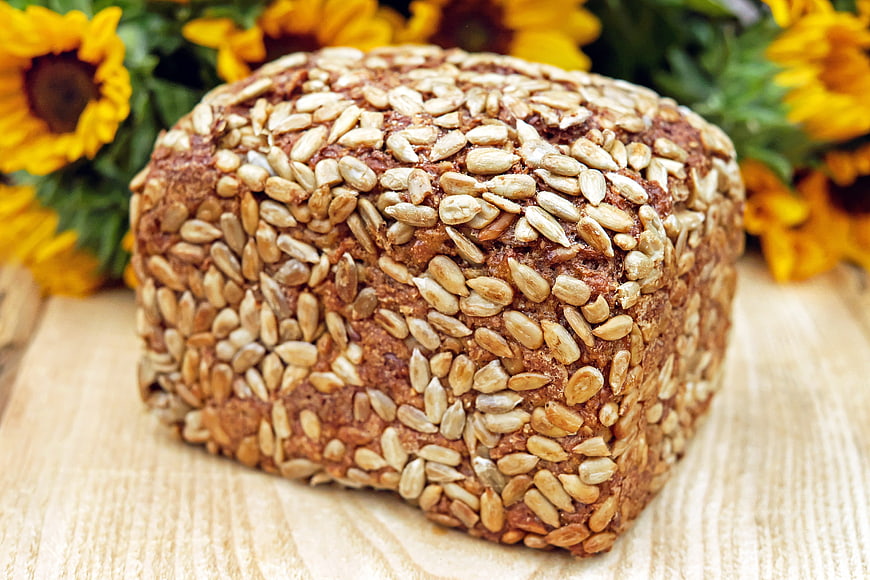 Artisan Sunflower Seed Bread Loaf on Wooden Board